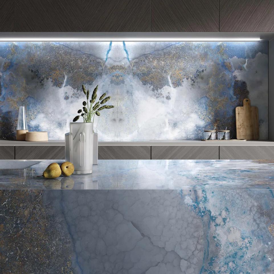 Thunderstorm porcelain slabs kitchen backsplash and countertop with coordinating light grey cabinet design.