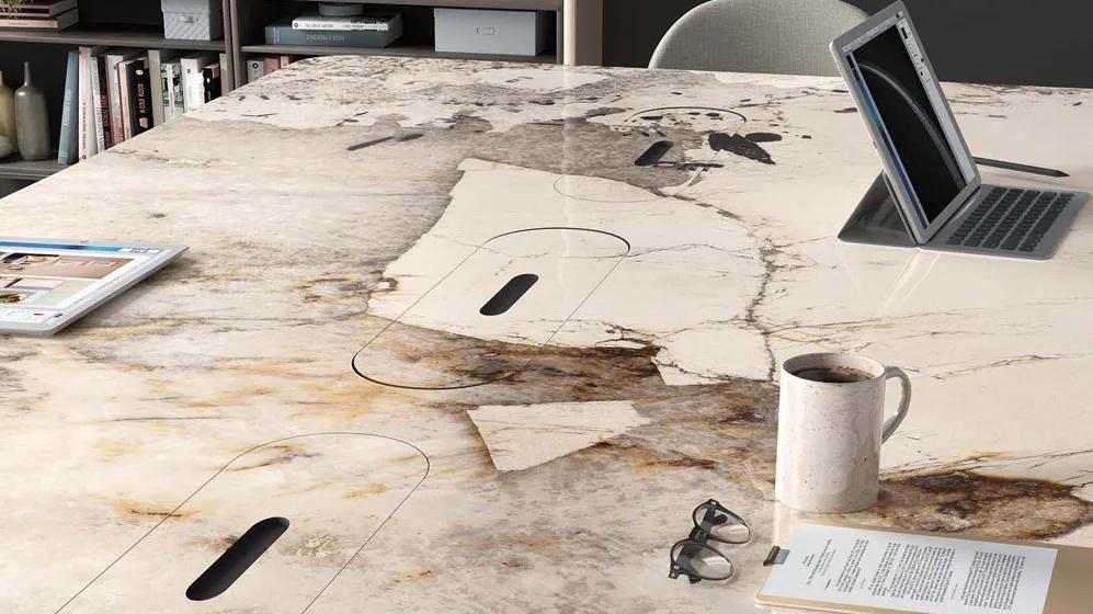 Modern workspace desk made from Magellano porcelain slabs with natural patterns.