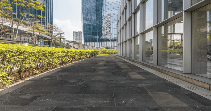 A sleek outdoor landscape featuring slip-resistant charcoal porcelain tile.