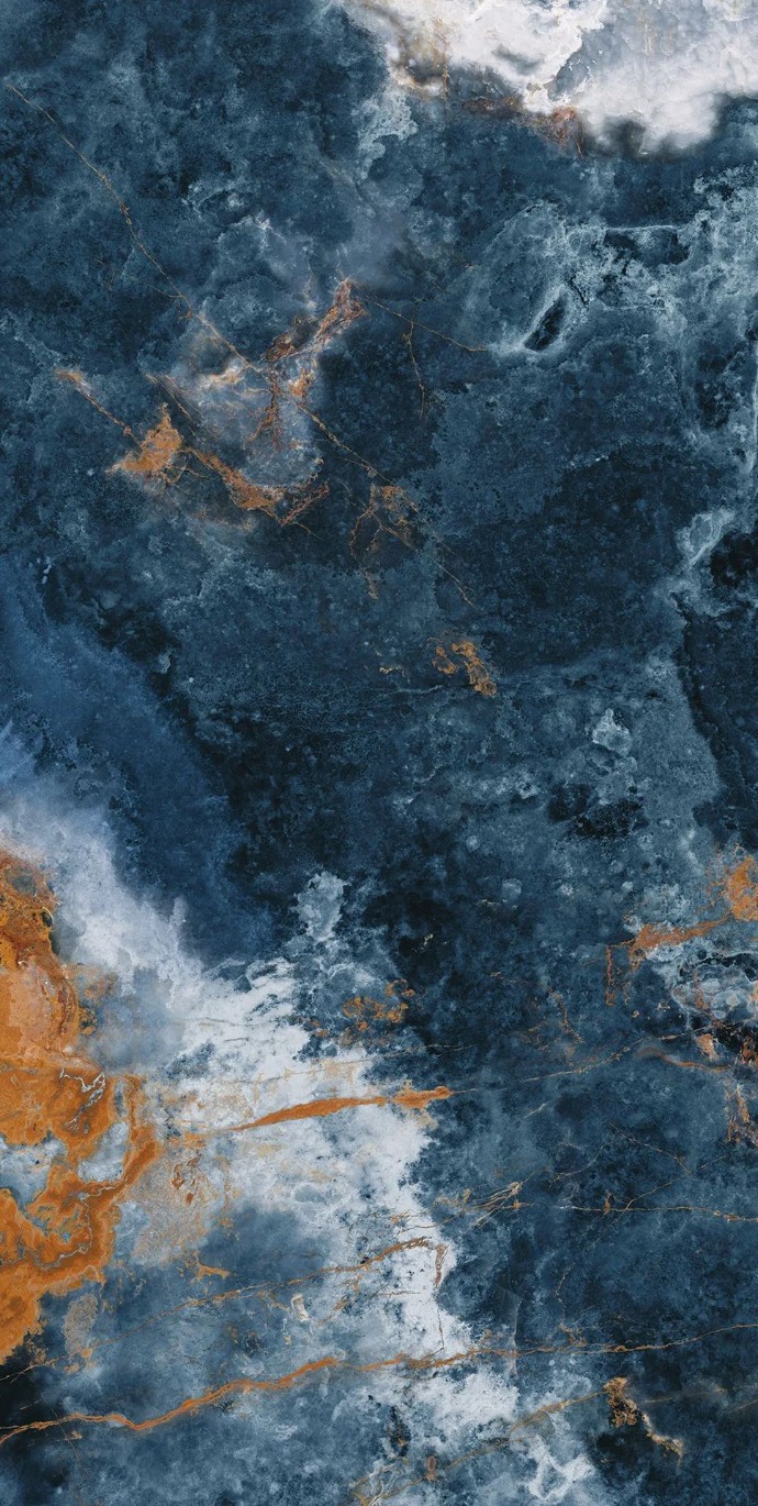 Full view of Ocean Blue porcelain slabs featuring dramatic blue and gold marble patterns.