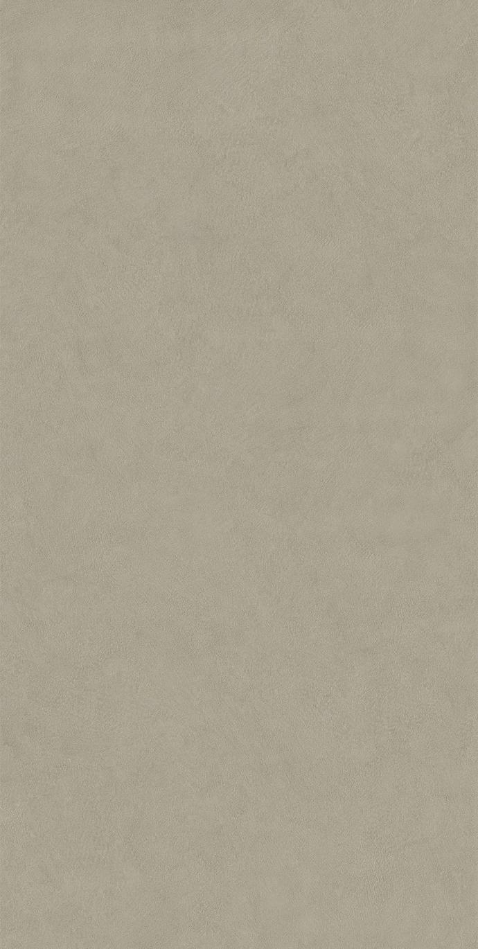 Close up view of Plaster Bone porcelain slabs showcasing authentic plaster surface texture.