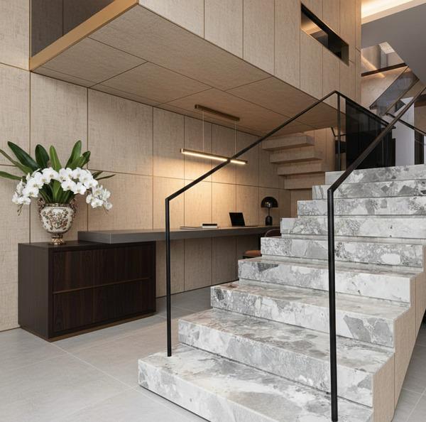 Natural stone staircase featuring grey and white marble patterns.