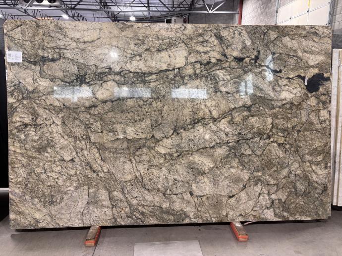 Beige and green granite slab at Nova Tile and Stone