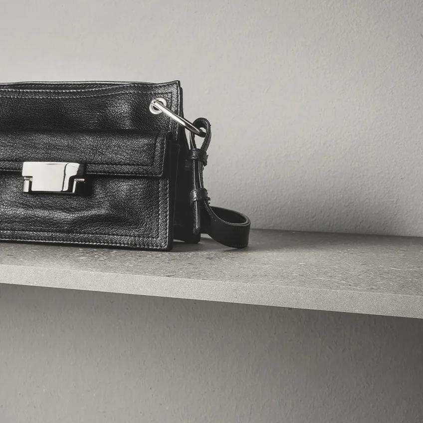 Luxury product display on Sandstone Light porcelain slabs surface highlighting premium texture and appearance.