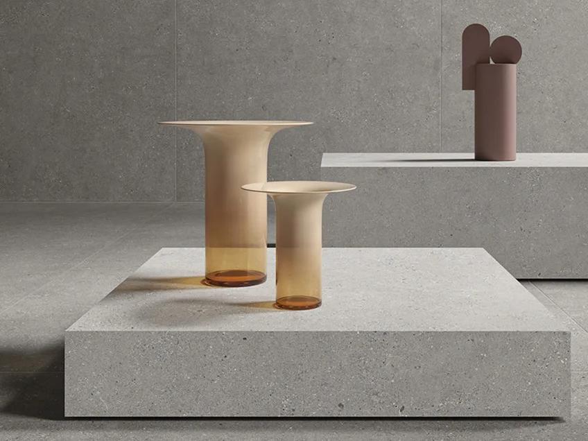 Sandstone Silver porcelain slabs featured in contemporary interior with artistic elements and elegant styling.