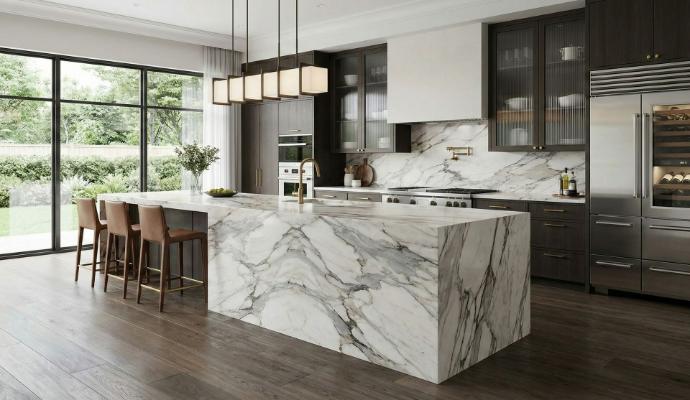 Modern kitchen with white marble island and dark cabinetry