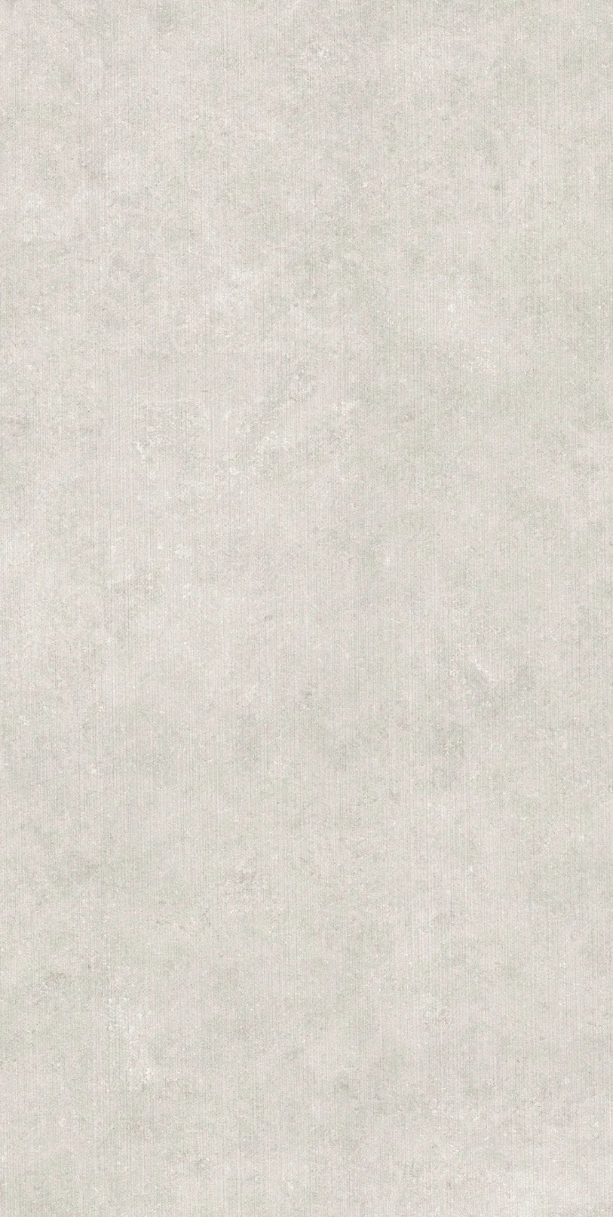 Full slab view of Fossil Row porcelain slabs with a light warm surface and fine grain.