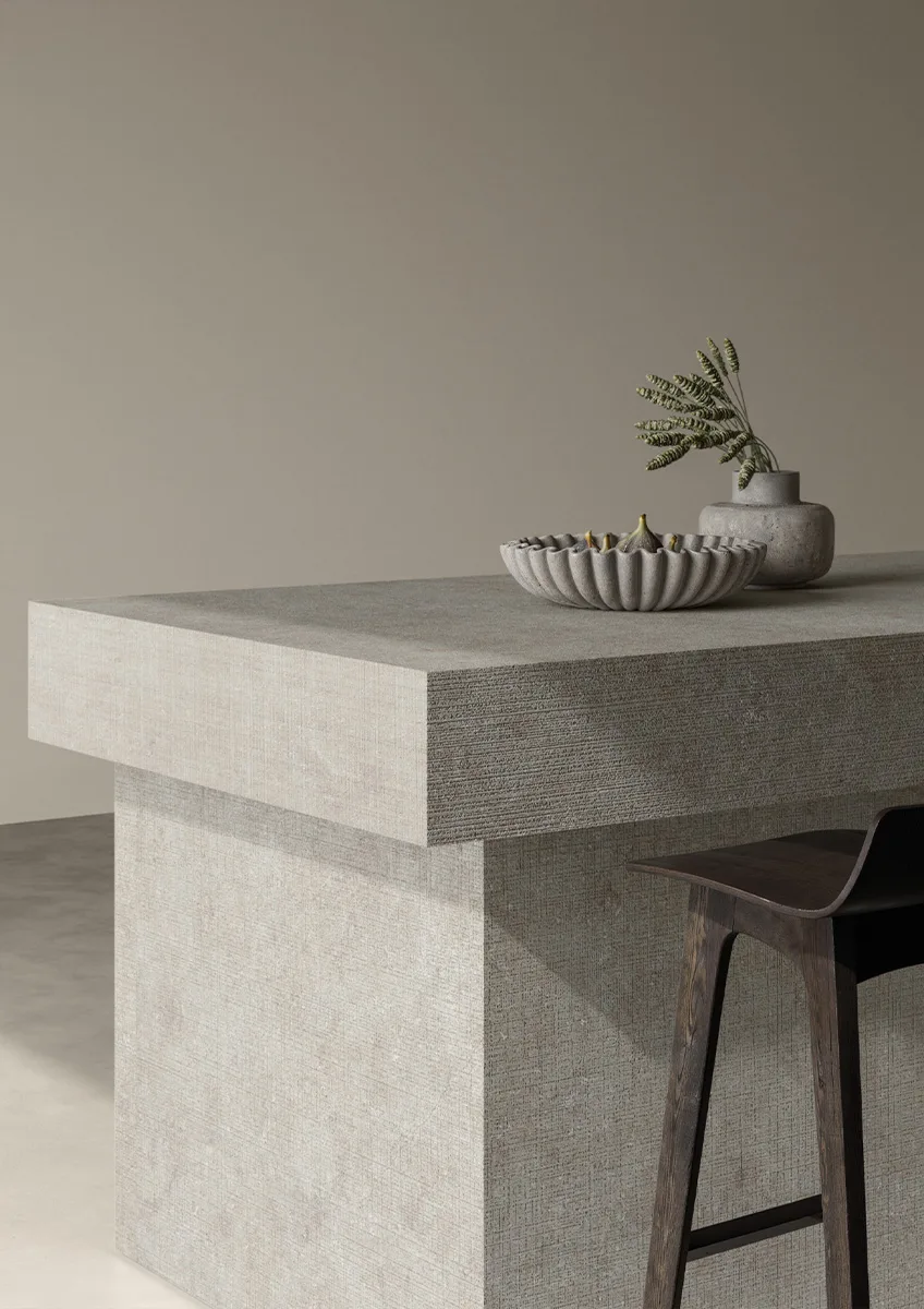 Luxury minimalist interior with Fossil porcelain slabs on walls and contemporary white furnishings.