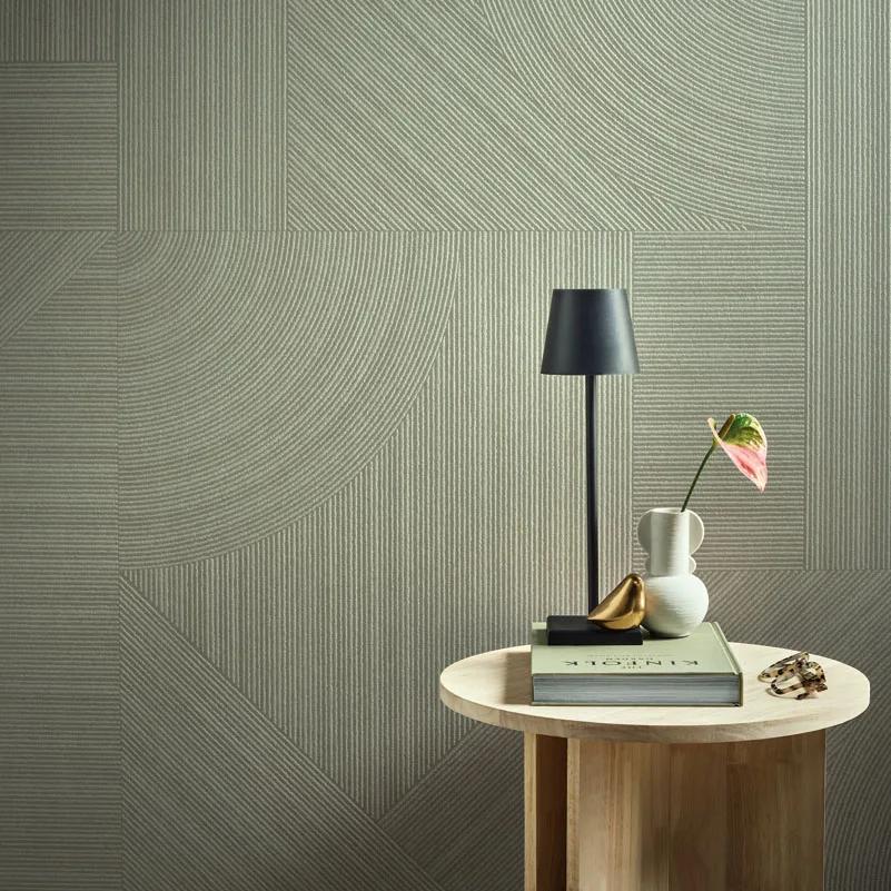 Ginza Midori porcelain slabs interior with black floor lamp and white round table styled arrangement.