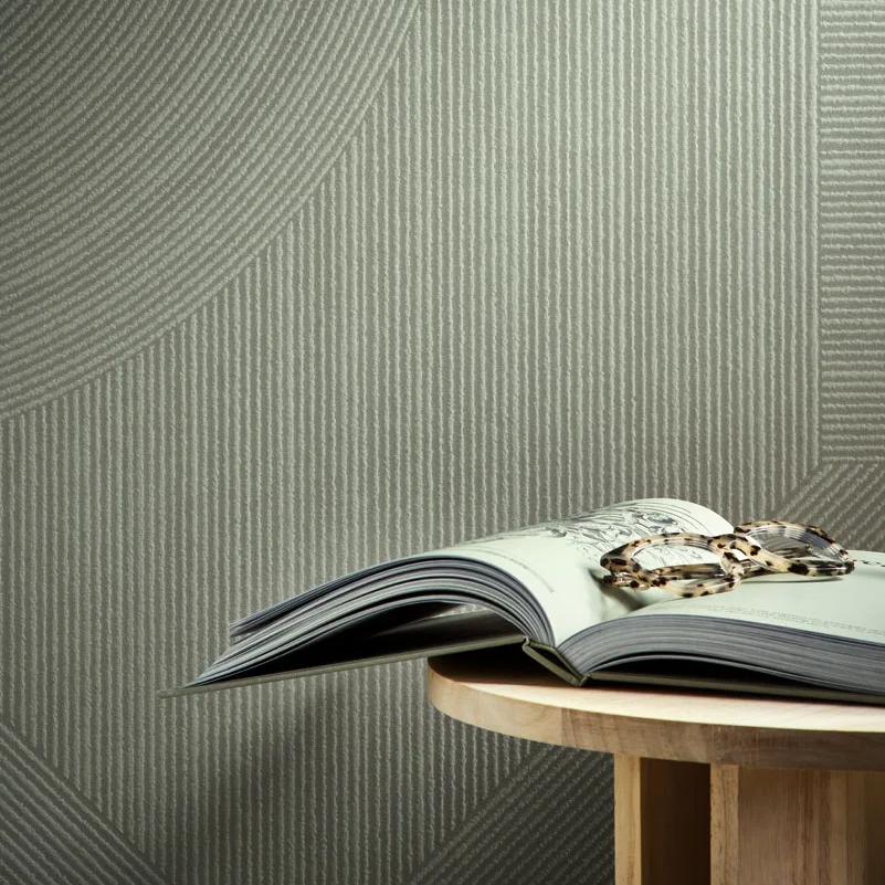 Ginza Midori porcelain slabs textured wall with wooden shelf displaying open magazine and elegant jewelry pieces.