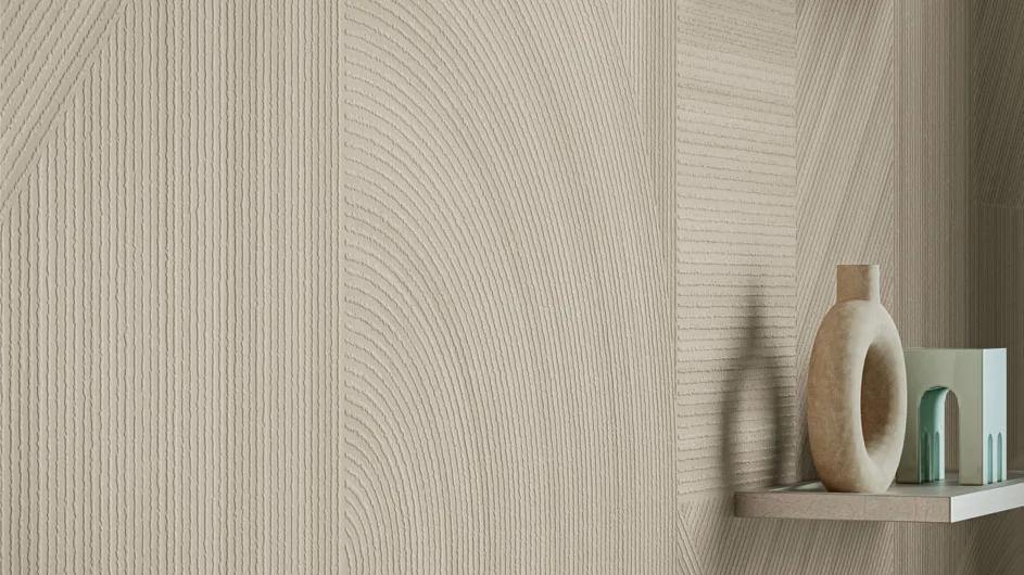 Ginza Doro porcelain slabs wall installation showcasing three-dimensional texture with decorative ceramic vases displayed.