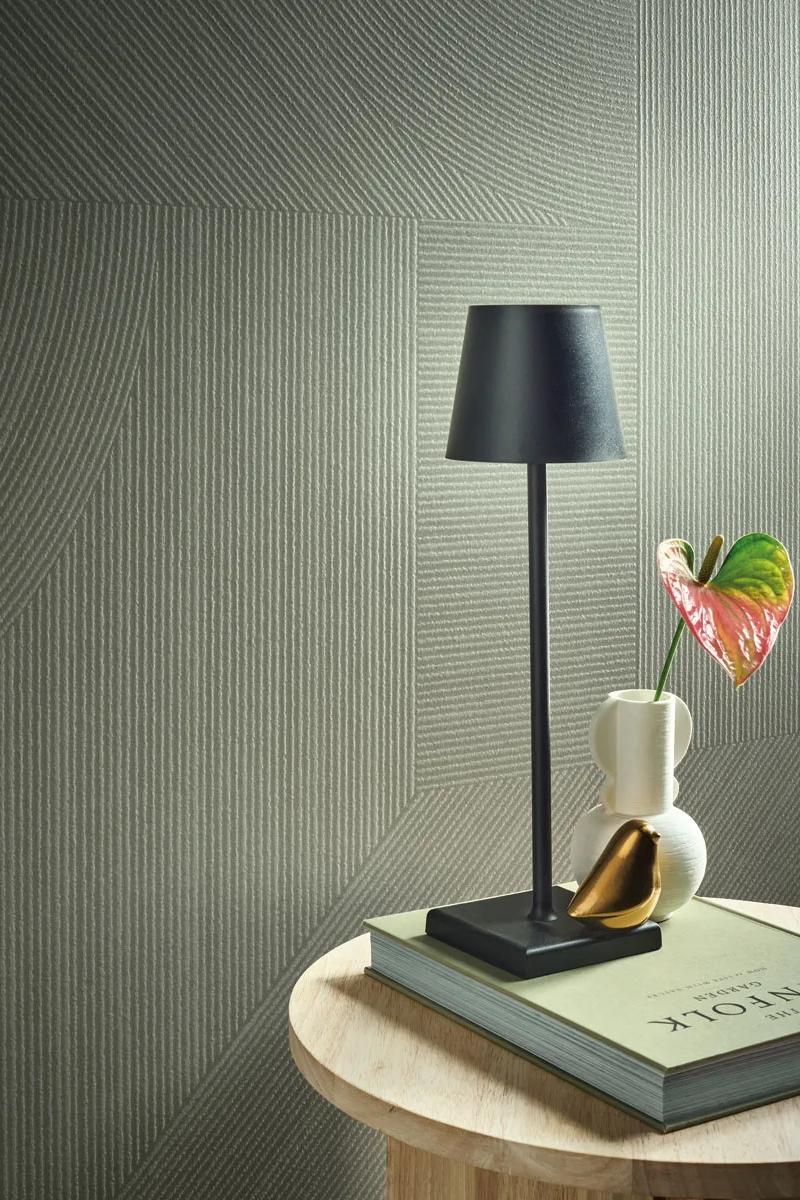 Table lamp and open book styled on Gordes porcelain slabs with fresh flower