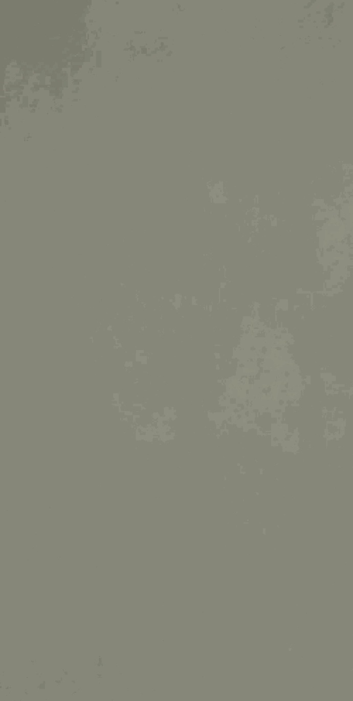 Full slab sample of Gordes porcelain slabs in matte sage green with subtle texture.