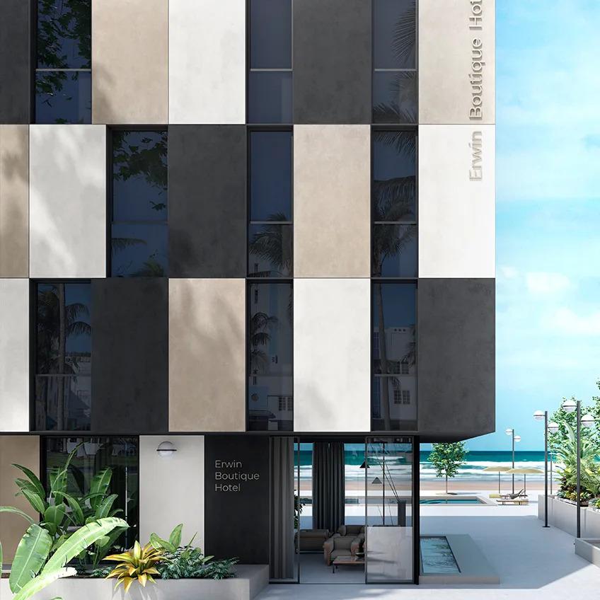 Total Black porcelain slabs used on a beachfront hotel exterior with mixed surface panels.