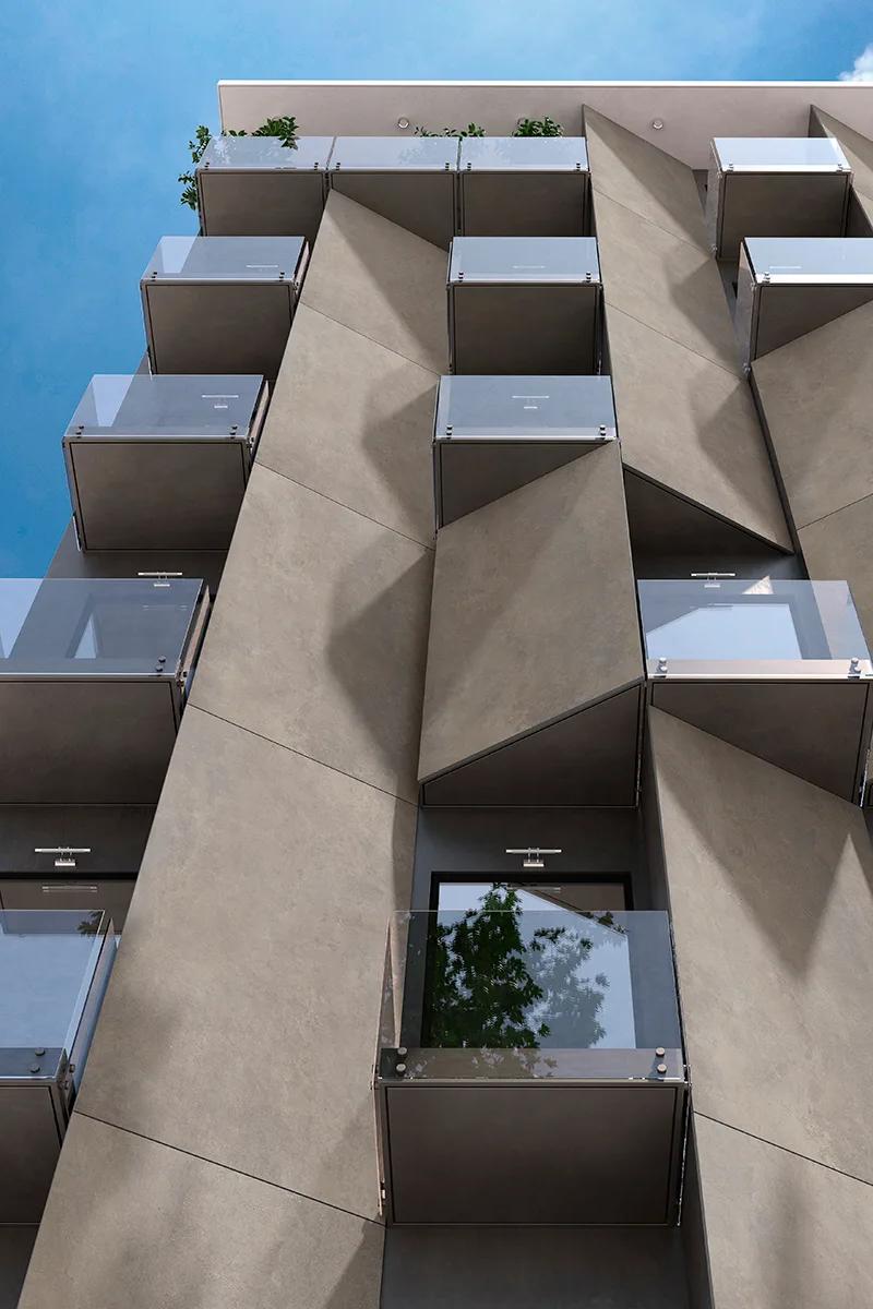 Residential building with geometric facade design using Total Grey porcelain slabs panels.