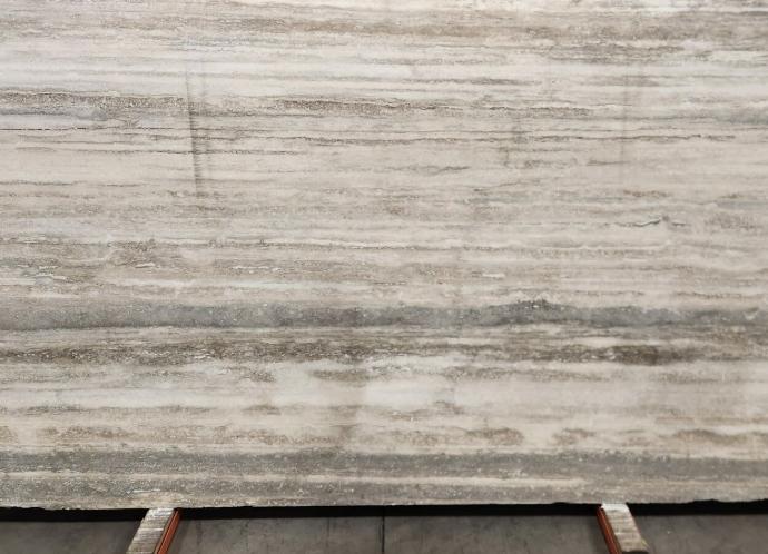 Grey travertine marble slab with linear veining