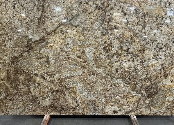Golden brown granite slab with bold veining and mixed mineral patterns