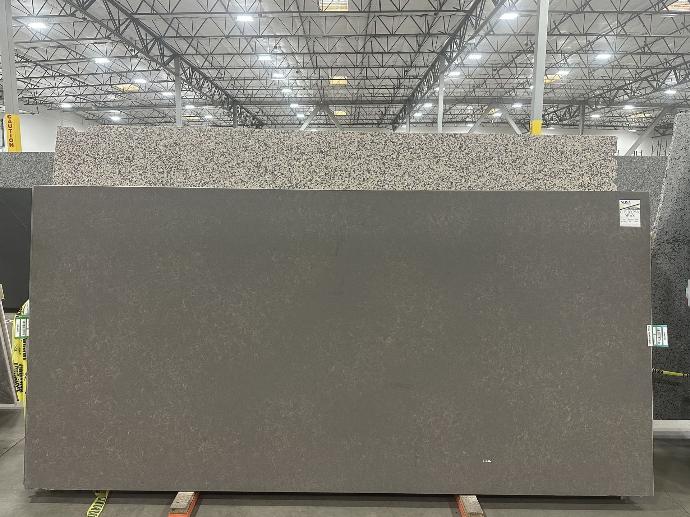 Santamargherita City Brown Spazz quartz slab with honed matte finish displayed in Nova Tile and Stone showroom