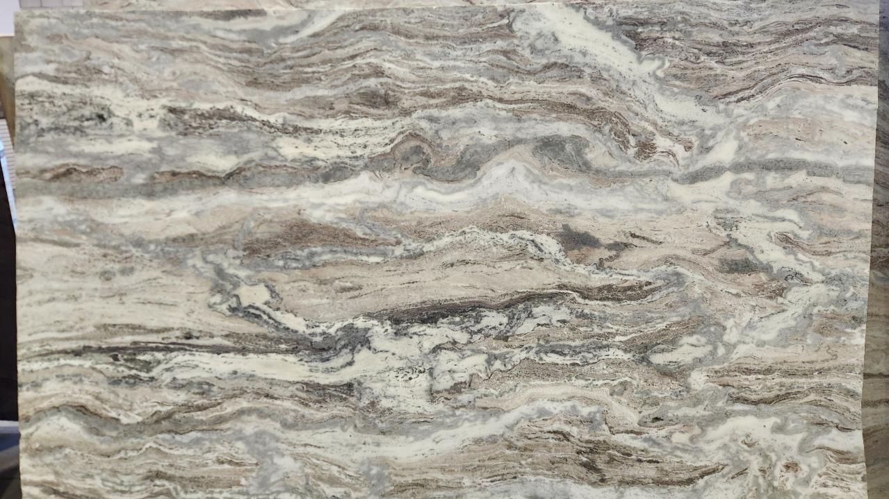 Honed Fantasy Brown dolomite slab showcasing sweeping, horizontal veining in shades of cream, gray, and earthy brown