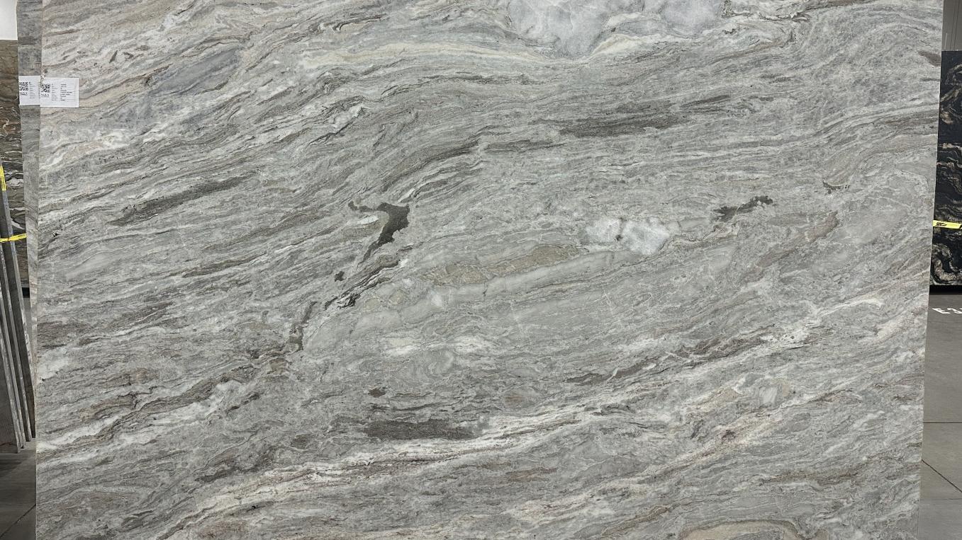 Honed Fantasy Brown dolomite slab featuring a smoky grey base with subtle, flowing charcoal and ivory veins