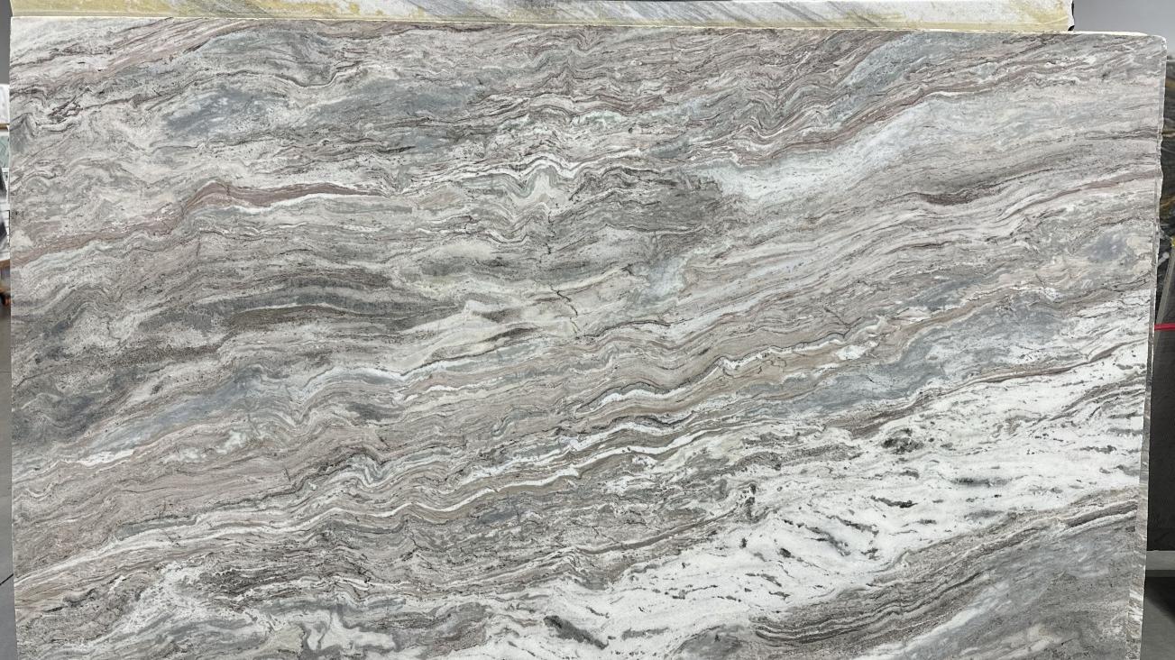 Honed Fantasy Brown dolomite slab with fine, undulating grey and brown patterns.
