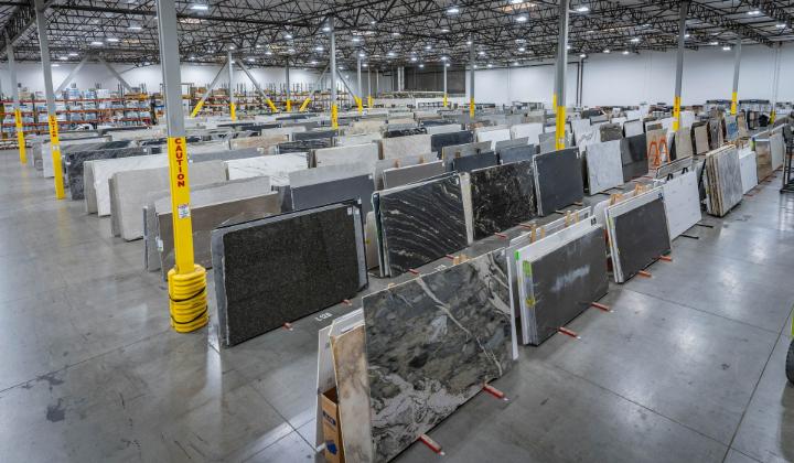 Large natural stone slab showroom with wide selection of granite and marble slabs on display