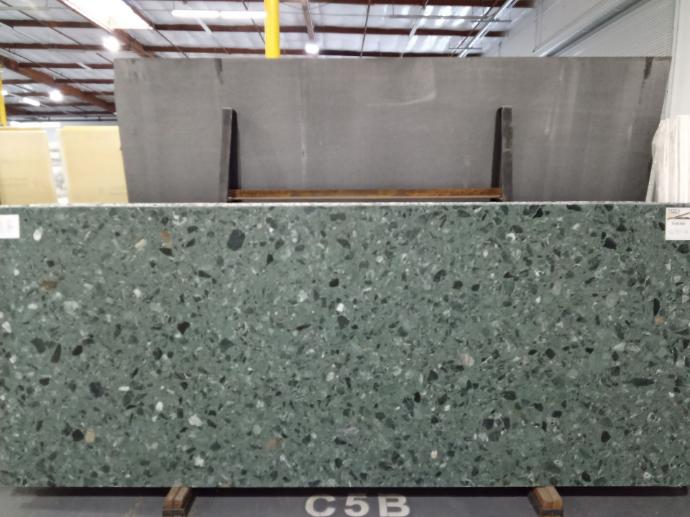 Verdi Alpi marble slab with green tones and natural stone fragments