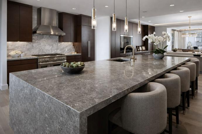 Gray natural stone countertop island in a modern luxury kitchen