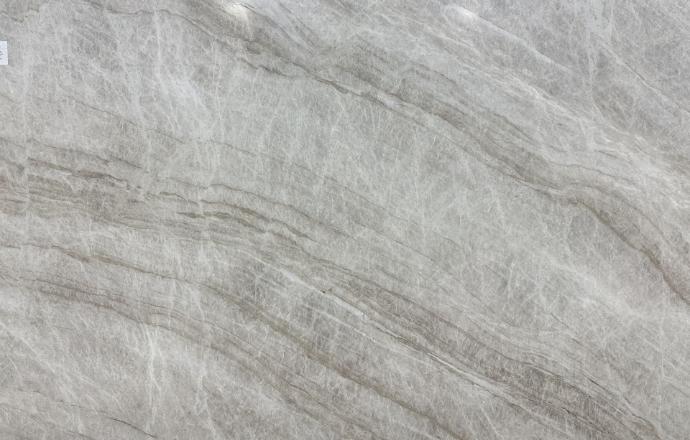 Taj Mahal quartzite slab with a warm gray, creamy base and subtle flowing veining