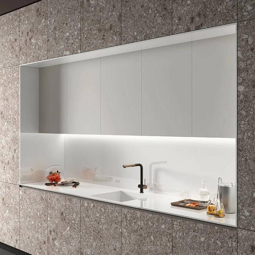 Sleek kitchen mirror with Milan Stone porcelain slabs showing elegant white countertop design