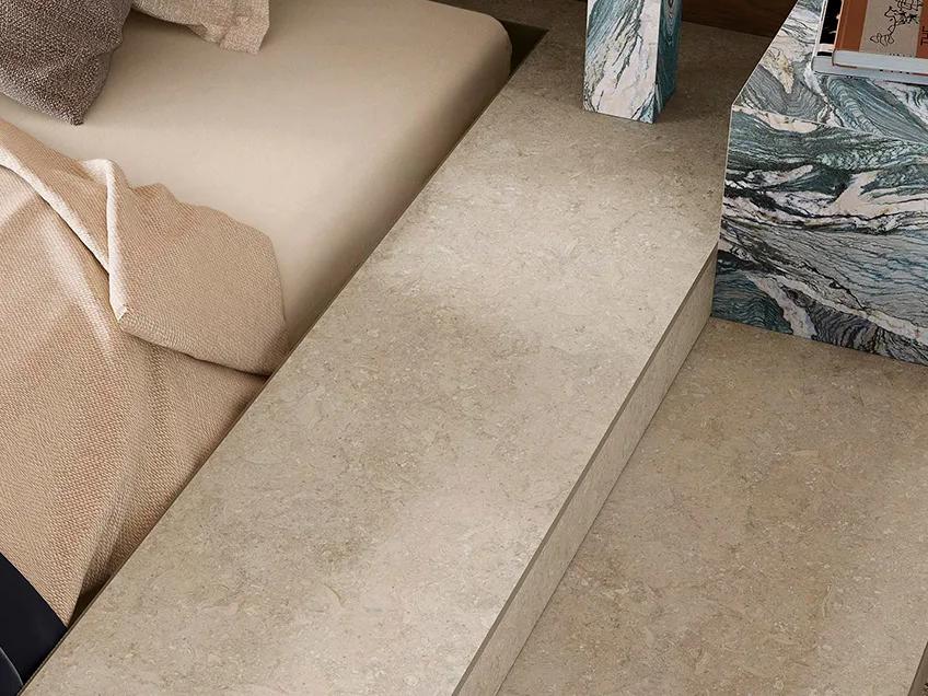 Palladium Ivory porcelain slabs used as elegant floor surface in modern lounge with neutral decor