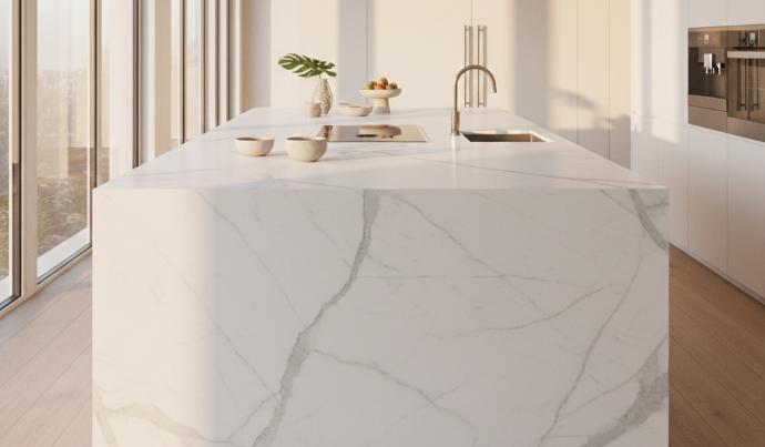 White marble kitchen island with soft gray veining in a modern kitchen