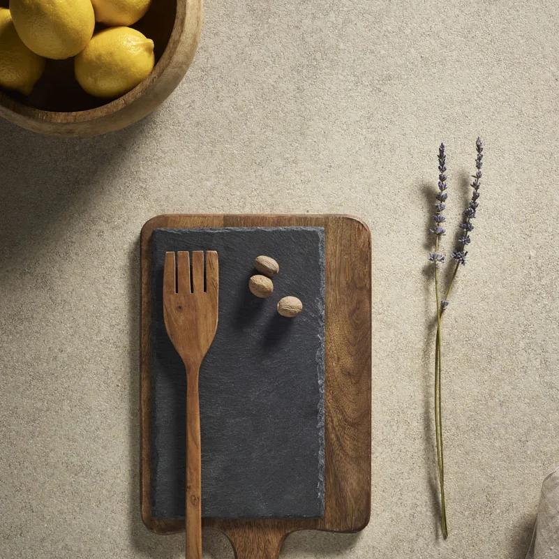 Provençale porcelain slabs featuring wooden utensils and dried lavender stems arrangement