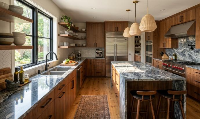 Polished granite countertops in a modern kitchen with warm wood cabinetry
