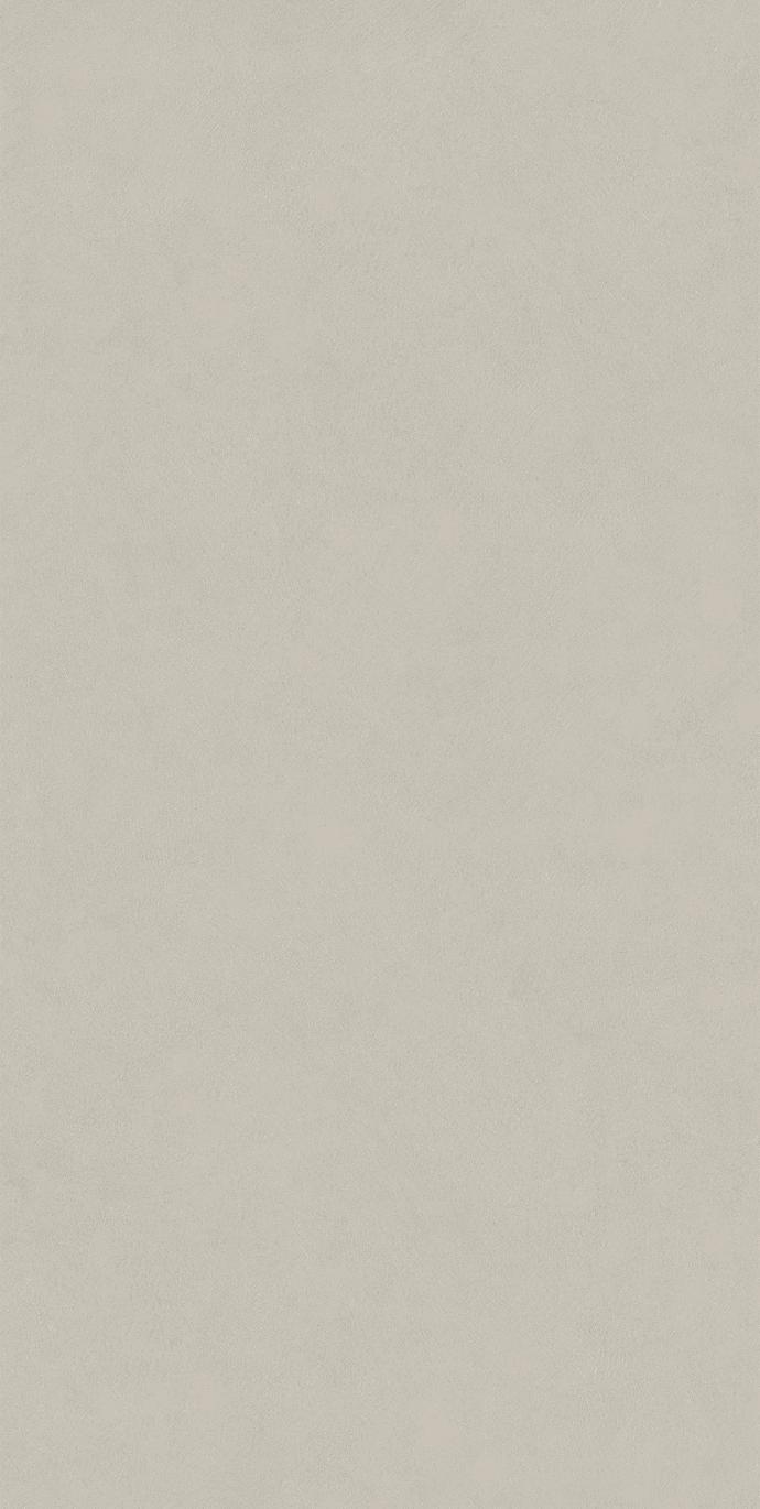 Texture sample of Plaster Snow porcelain slabs showing light warm gray tone finish