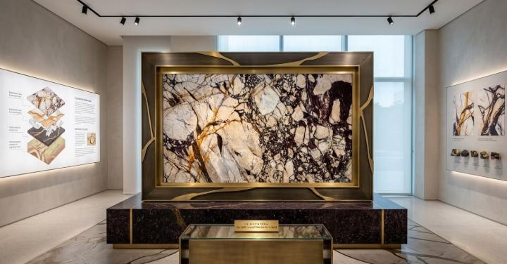 Modern display room with backlit Calacatta Viola marble slab