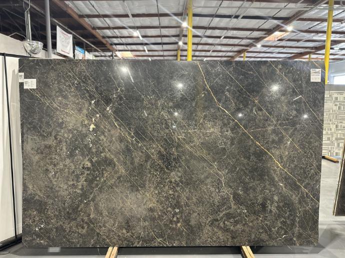 Calacatta Black and Gold marble slab in polished finish displayed in Nova Tile and Stone showroom