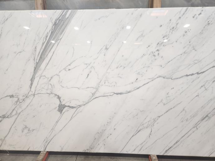 Polished Calacatta marble slab at Nova Tile and Stone showroom
