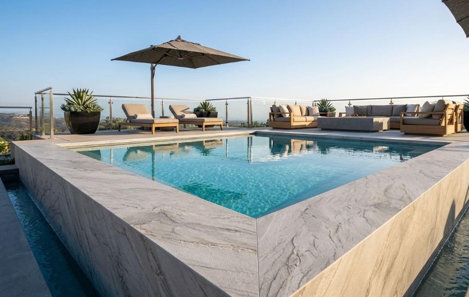 Rooftop pool deck with high-end luxury Mont Blanc quartzite pool surround