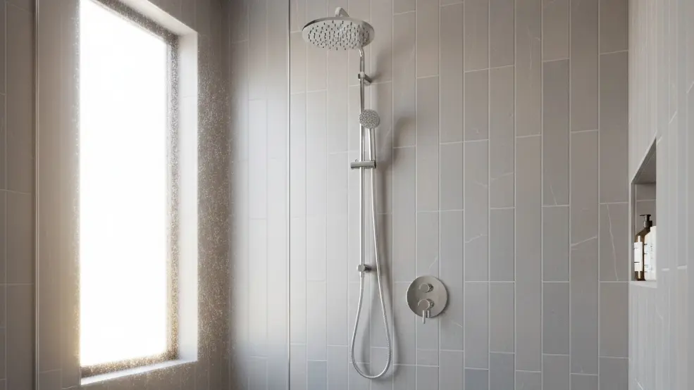 Shower wall in light grey subway tile with vertical layout,