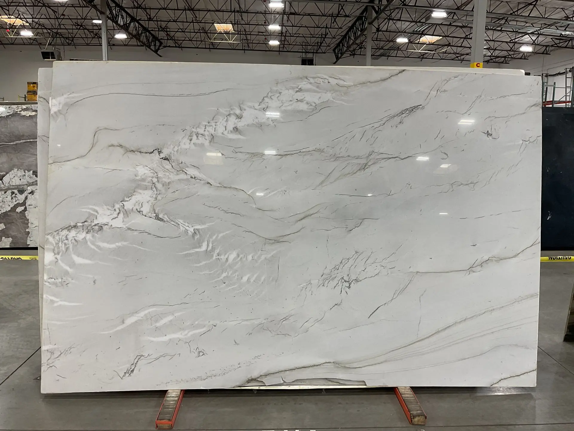 Polished Zermatt quartzite slab with soft gray veining, available at Nova Tile and Stone in Reno, NV