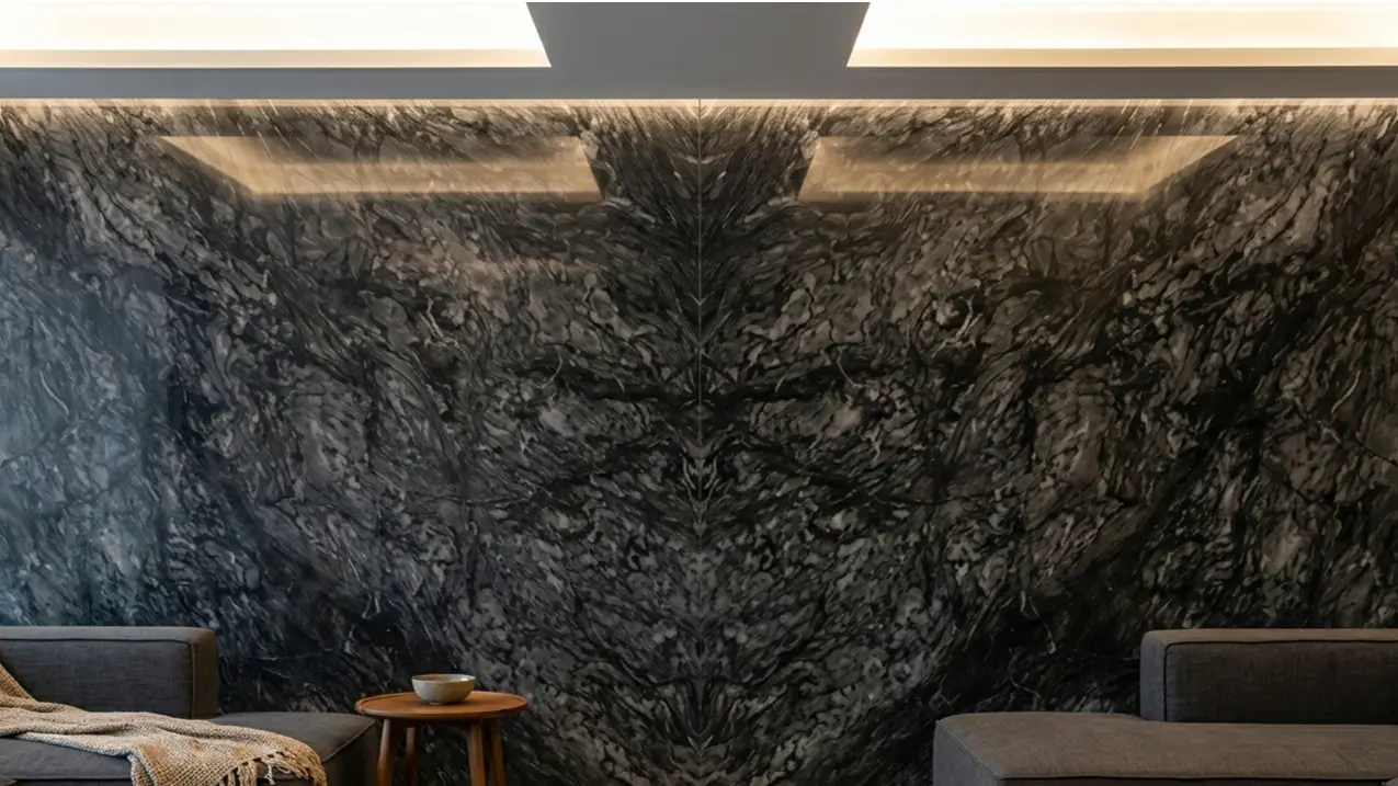 Graphite Marble Living Room Wall book-matched slab panels showing symmetrical natural stone veining pattern
