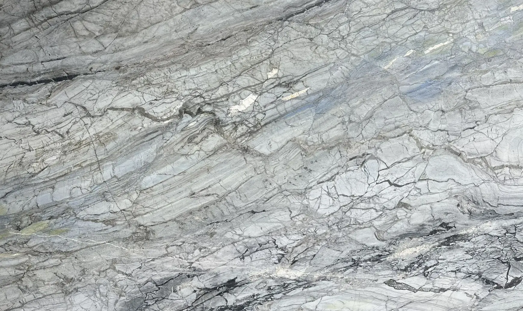 Invisible Blue marble slab with soft blue-gray tones and layered natural veining.