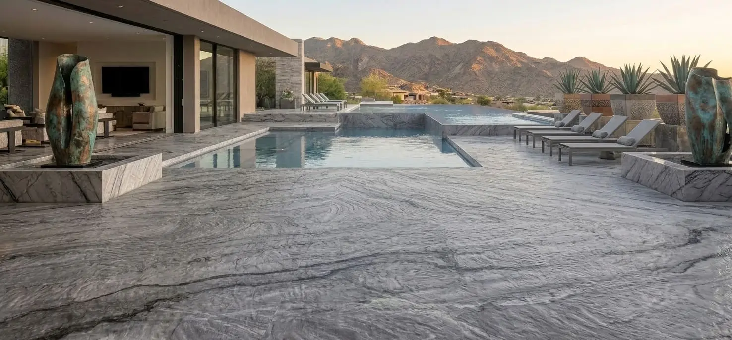 Luxury pool deck featuring Allure quartzite specialty slabs with natural grey veining