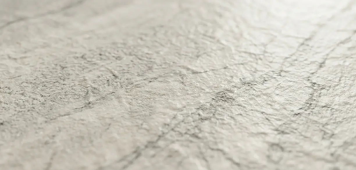 Conceptual rendering of leathered dolomite countertops close-up showing subtly textured surface with soft cream and gray veining