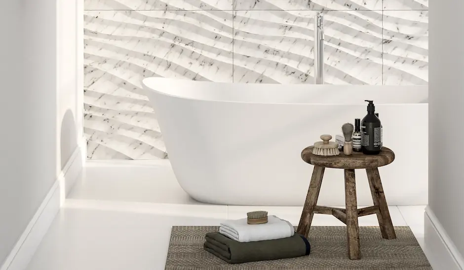 3D textured subway tile layout in a modern bathroom space.