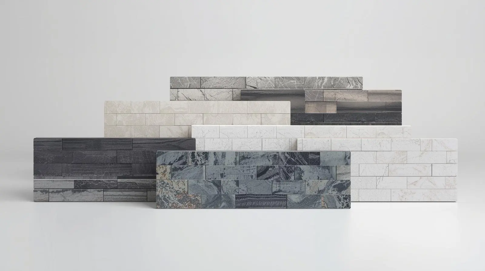 Six rectangular panels of stacked natural stone in various grey and white subway tile design, displayed on a white surface.