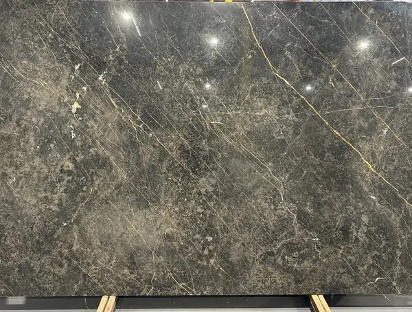 Black and gold granite slab with dramatic veining