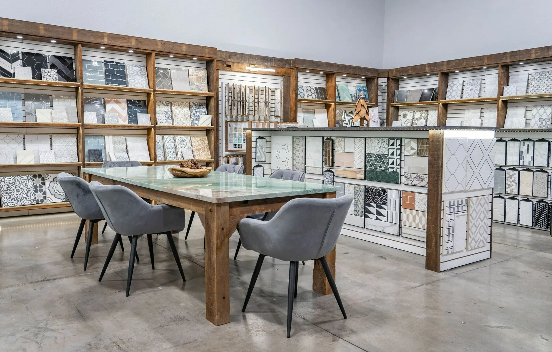 Nova Tile and Stone showroom interior displaying tile samples on wall shelves