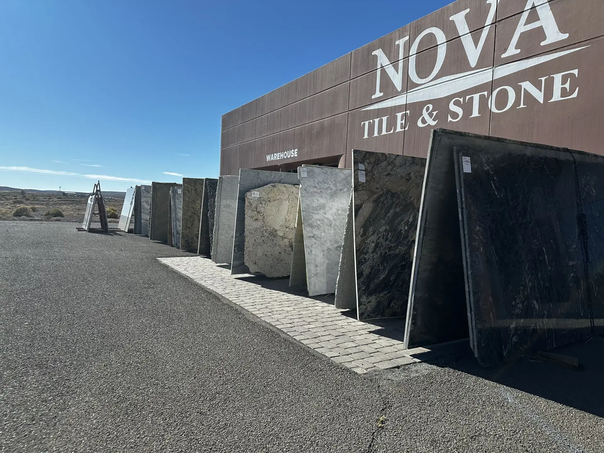 Exterior view of Nova Tile and Stone Fernley showroom featuring stone slab and tile displays